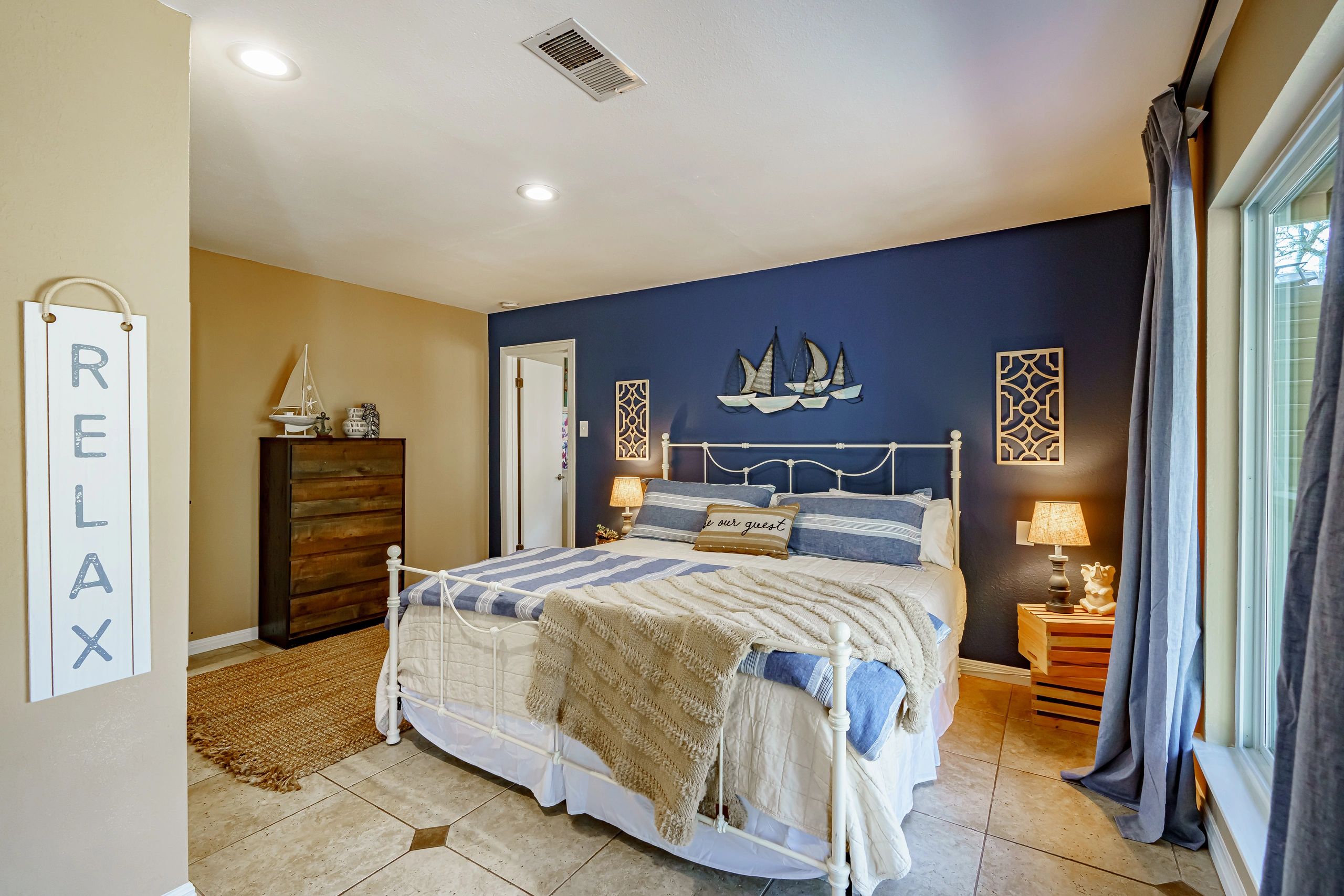 Bedroom with RELAX sign
